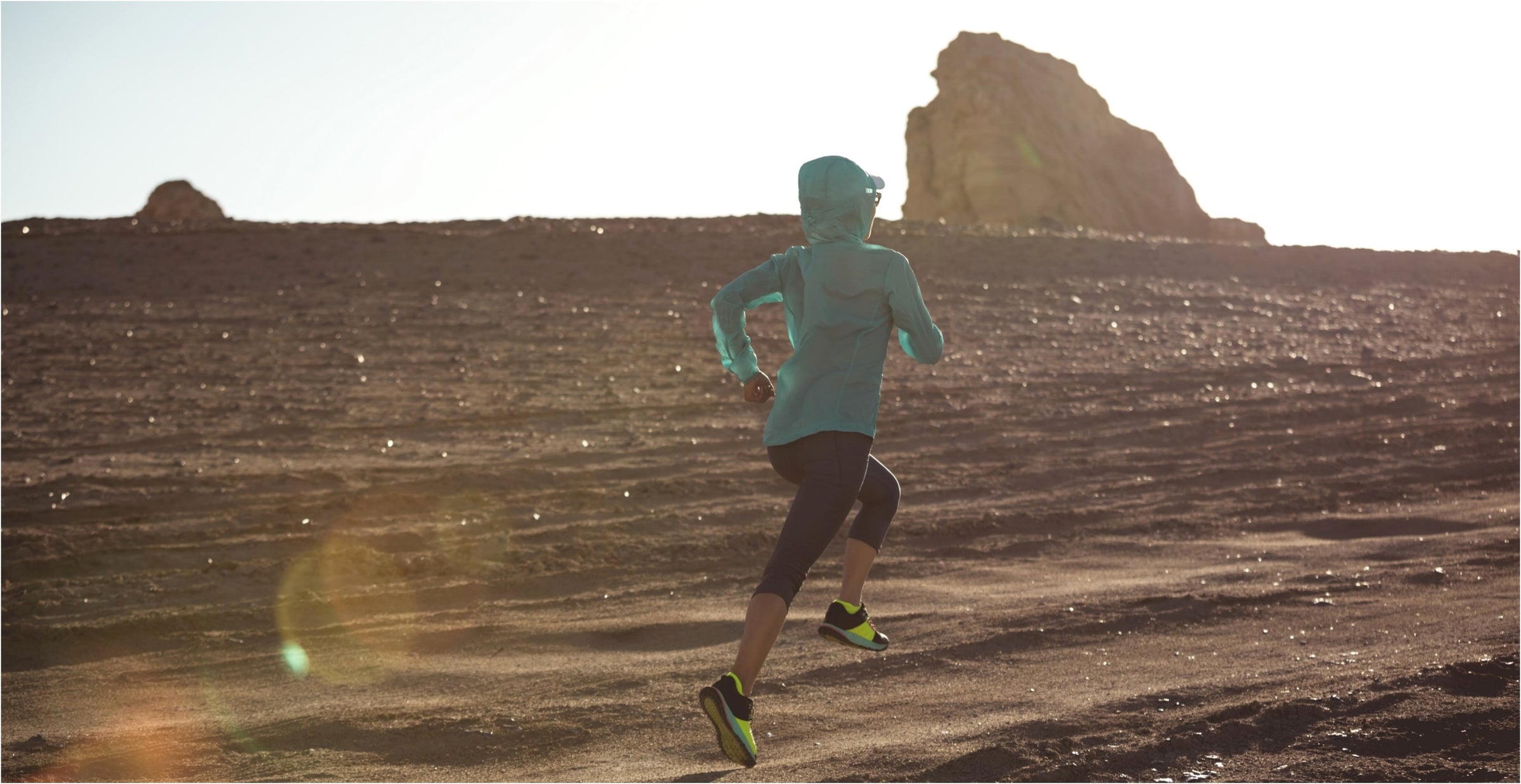 Woman jogging through the desert